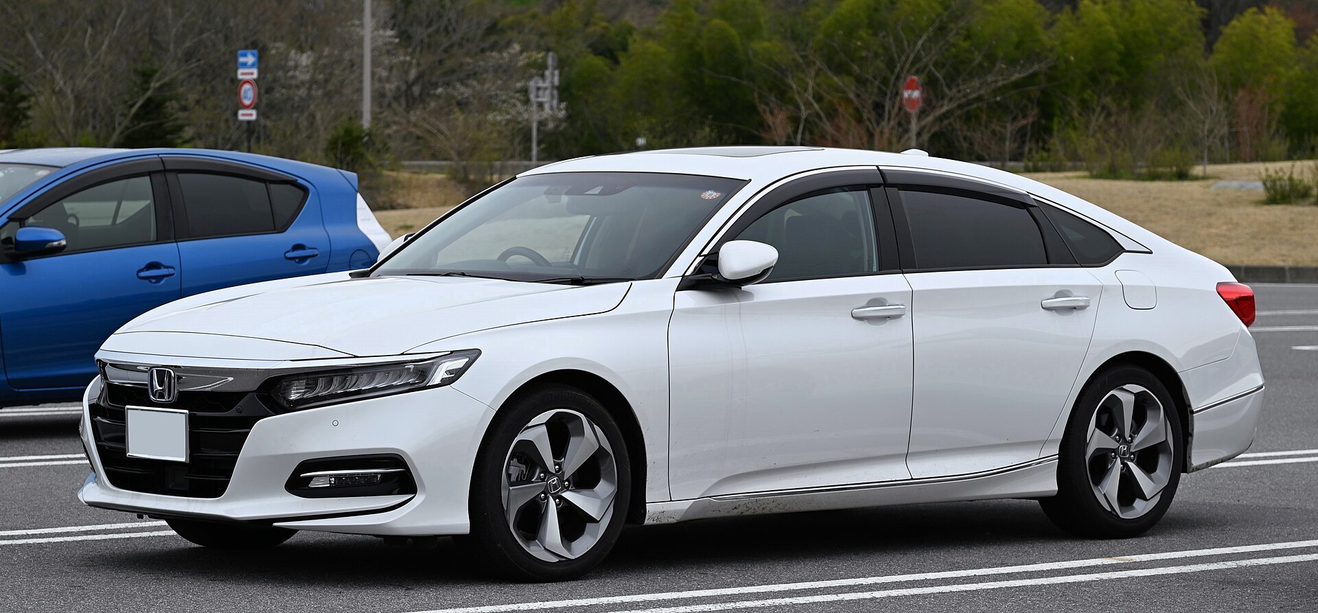 Honda Accord e-HEV hybrid sedan photographed outdoors.