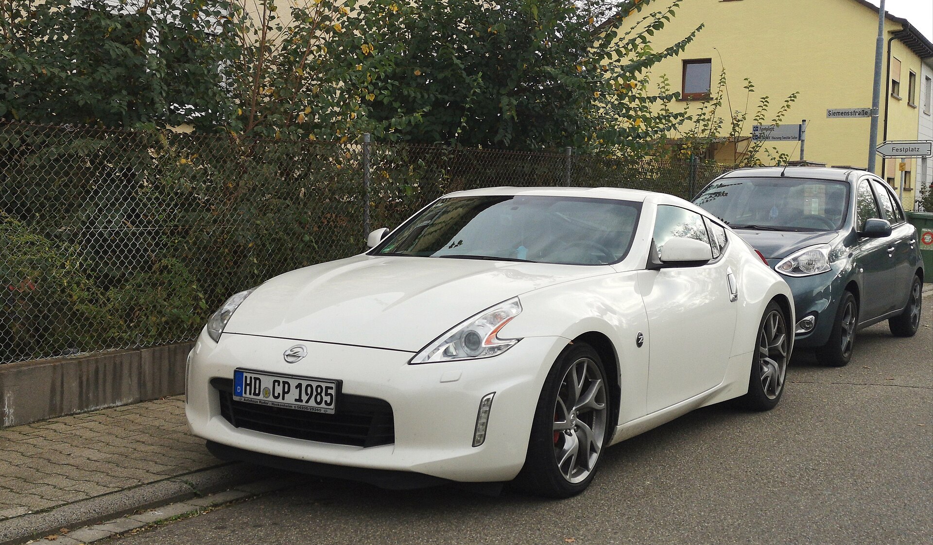 Nissan 370Z photographed from the front three-quarter angle in daylight.