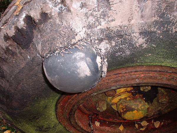 Close-up of a tire sidewall bulge indicating structural damage.