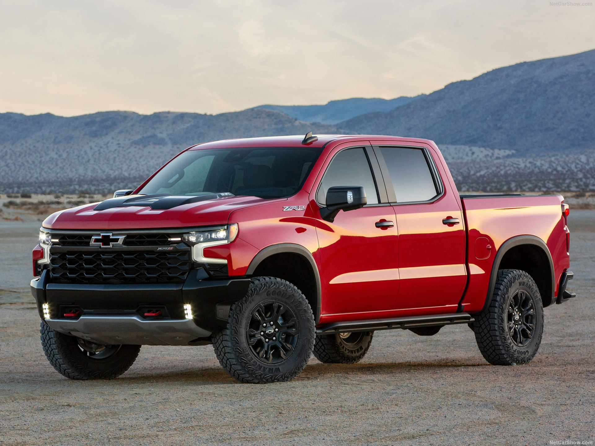 Red Chevrolet Silverado 1500 ZR2 in the desert at dusk
